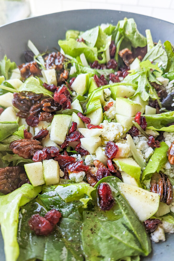 a close up photo of a mixed greens salad