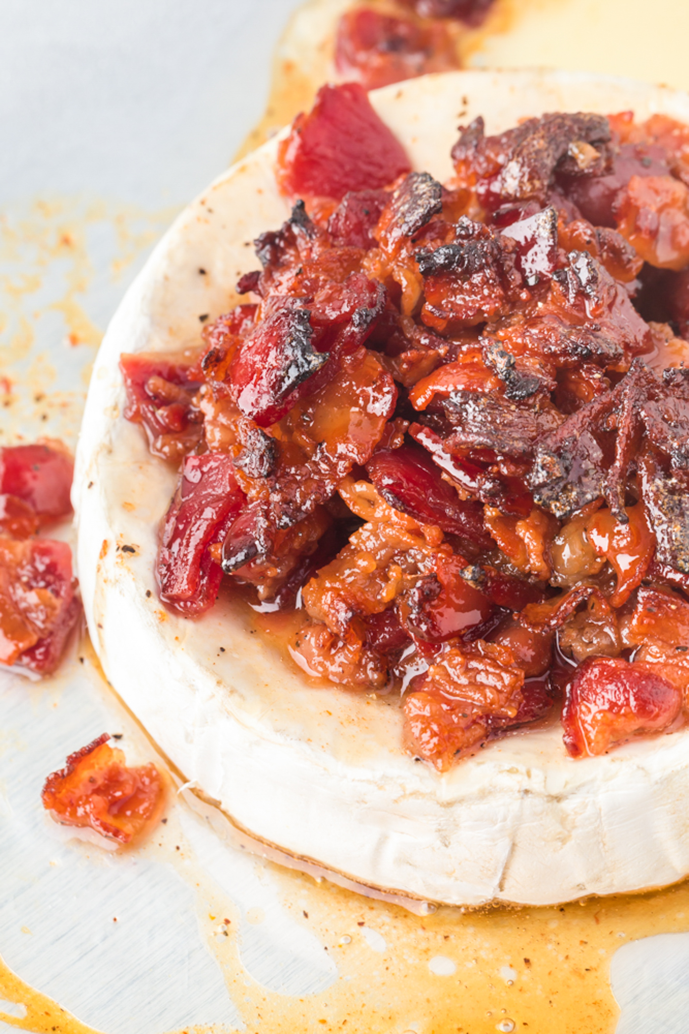A photo of candied bacon baked brie