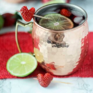 Strawberry Moscow Mules are a super easy way to mix up traditional moscow mules! Serve in a frosty copper mug for the perfect cocktail!