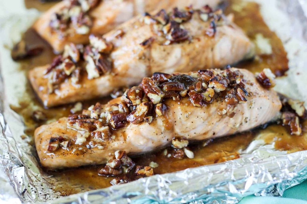 of A photo of baked salmon with pecan brown sugar glaze
