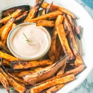 a photo of sweet potato fries with aioli dipping sauce