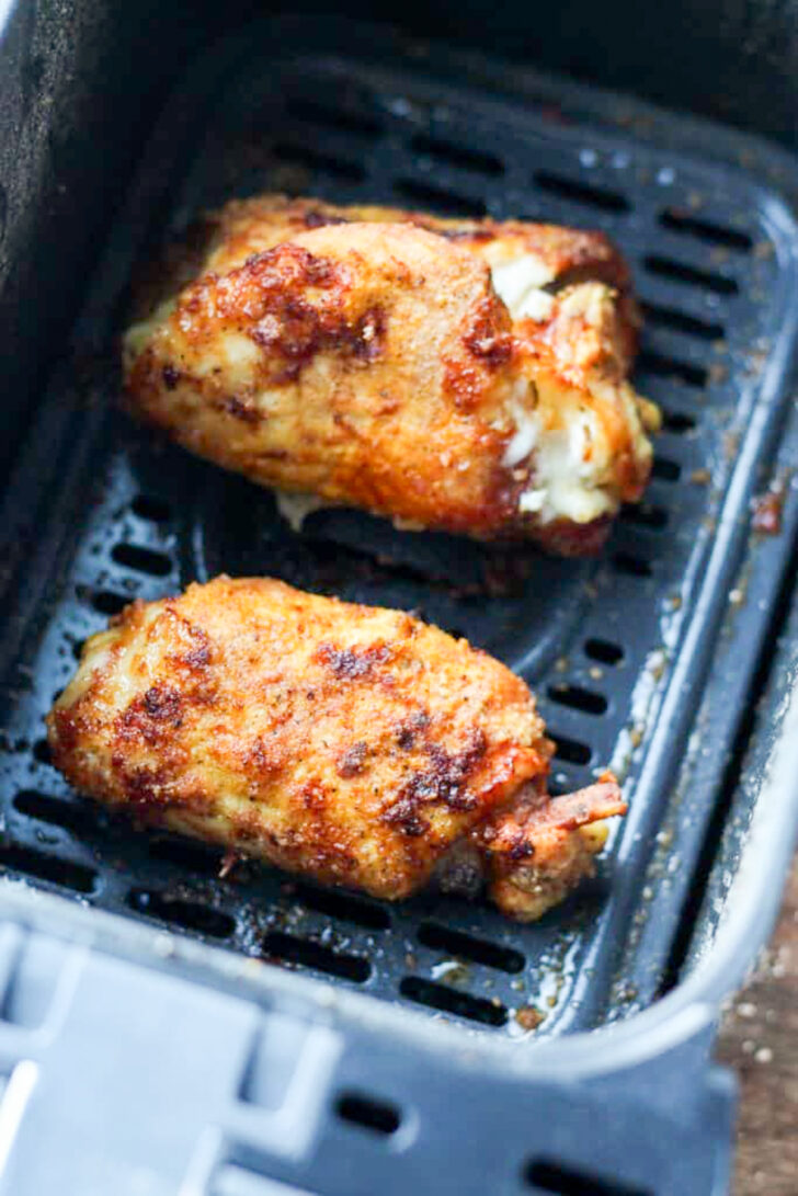 a photo of air fryer chicken cordon bleu in an air fryer basket