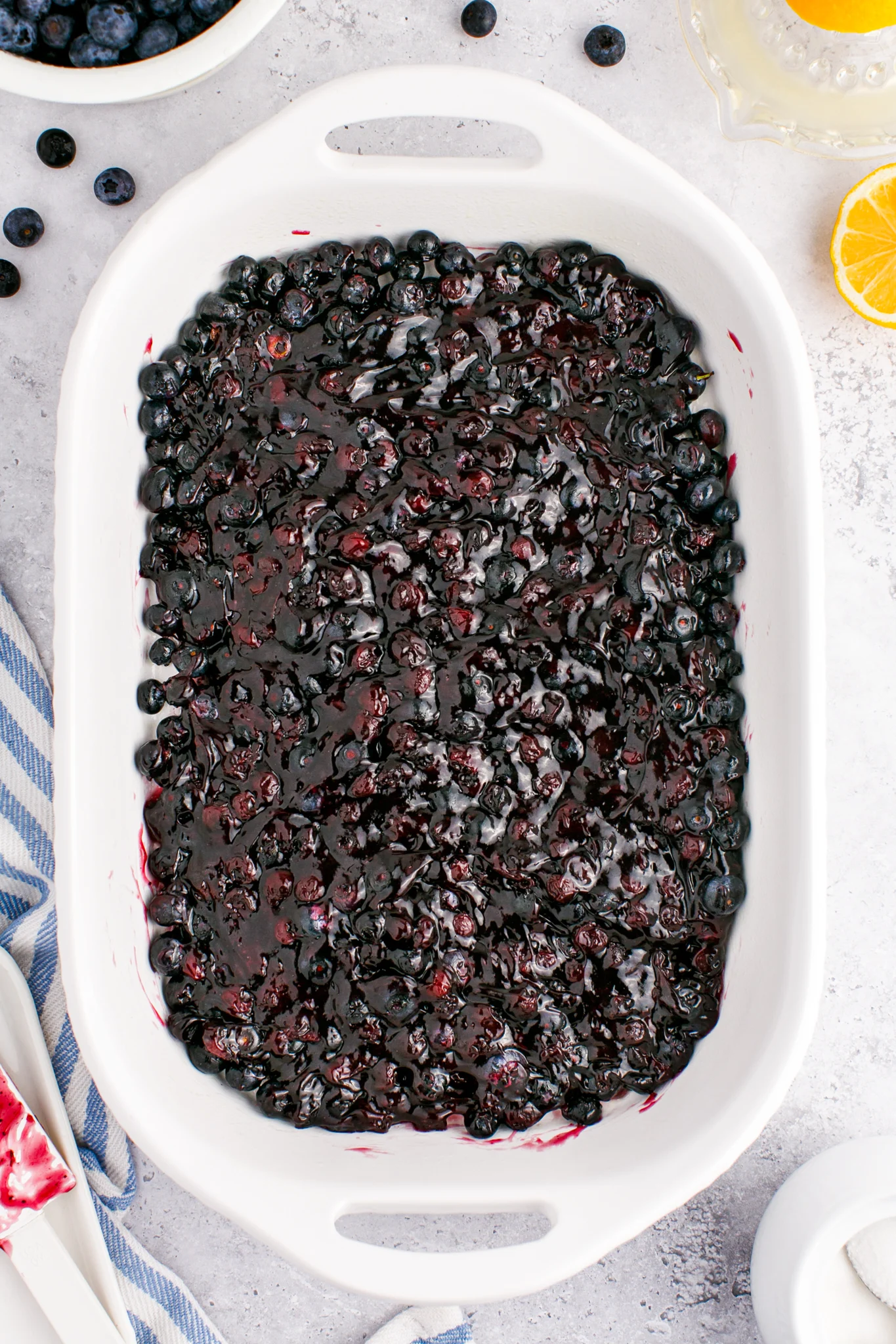 a photo of blueberry cobbler filling in a large dish