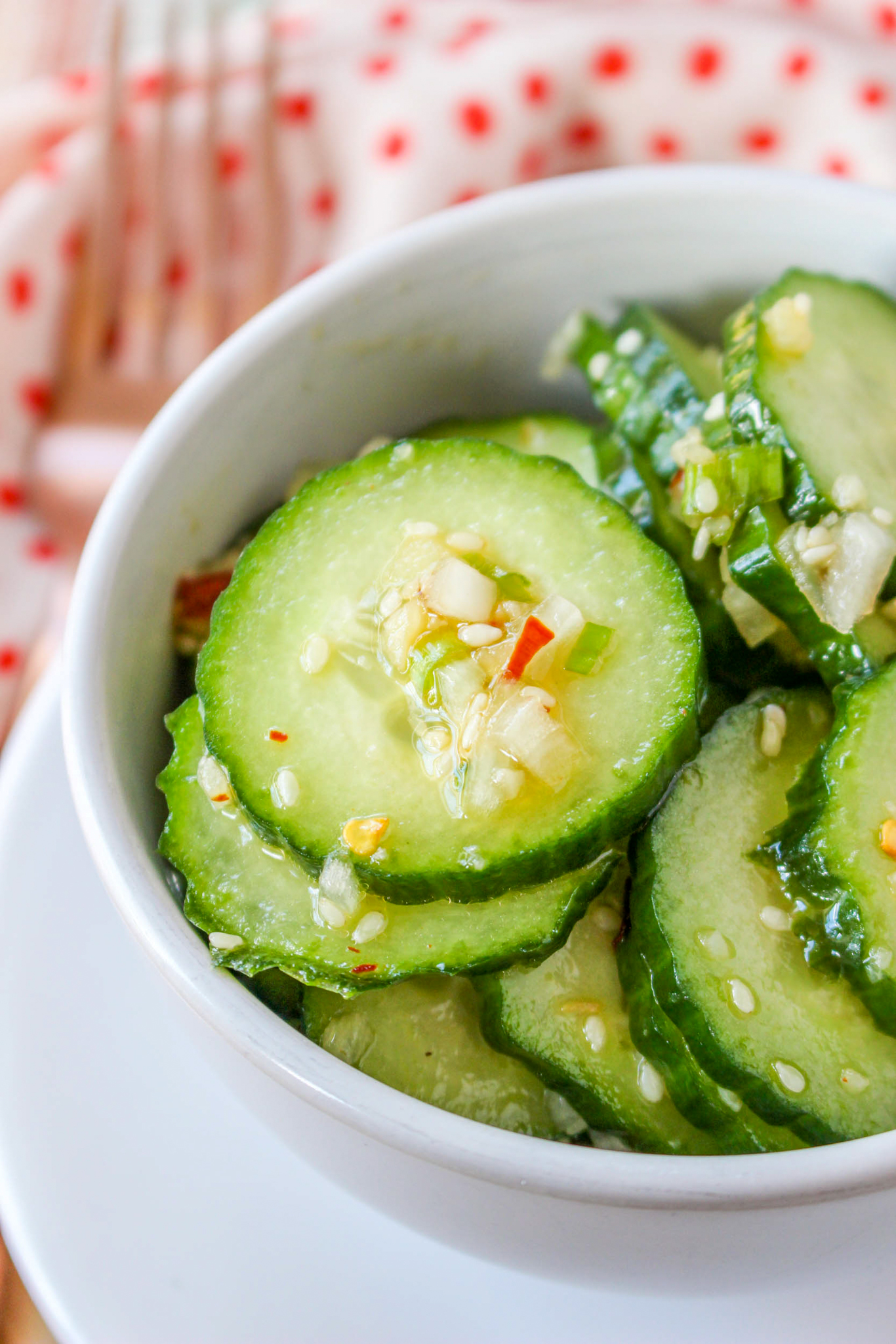 a photo of asian cucumber salad in a bowl
