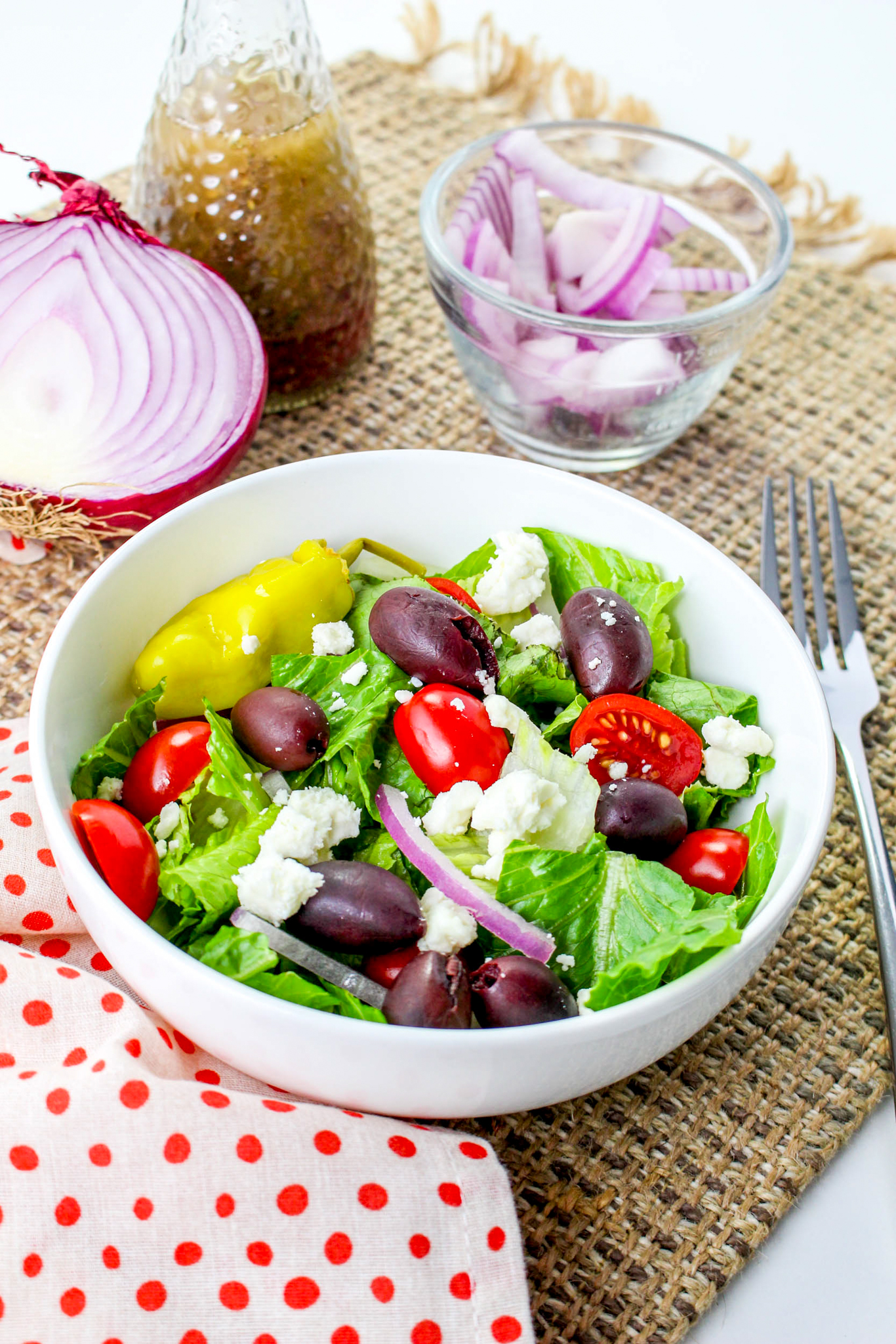A photo of Panera greek salad in a white bowl