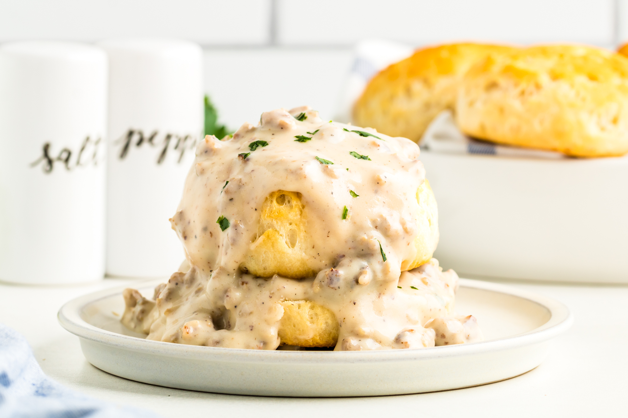 A photo of biscuits and gravy on a plate