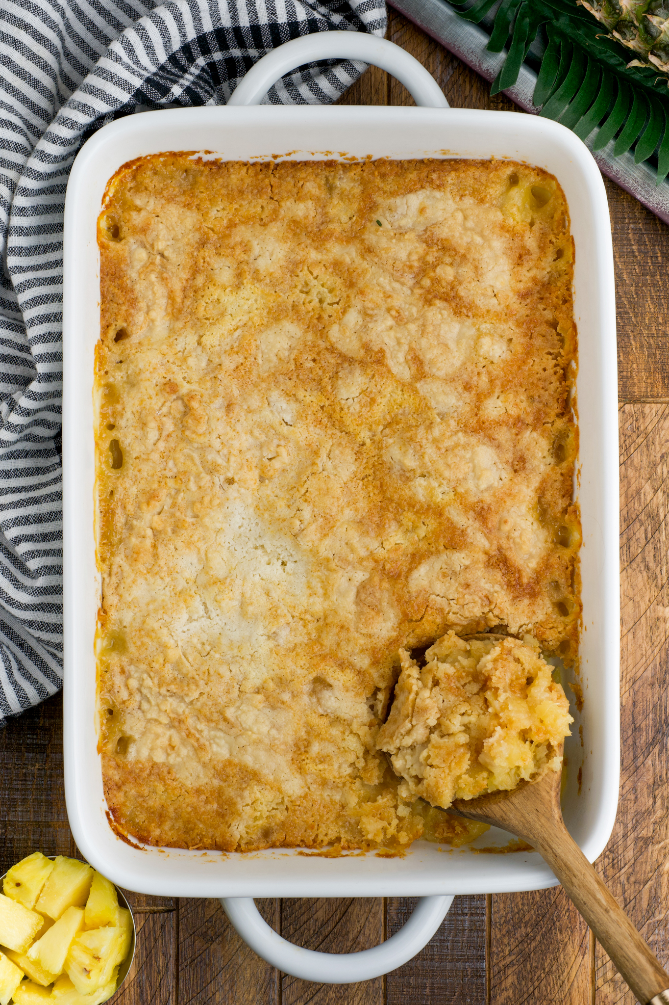 a photo of pineapple cobbler in a casserole dish
