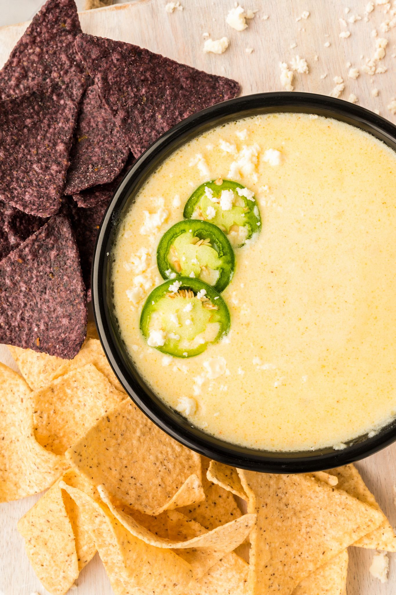 an overhead photo of white queso dip