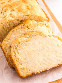 a photo of sliced soda bread with butter on it