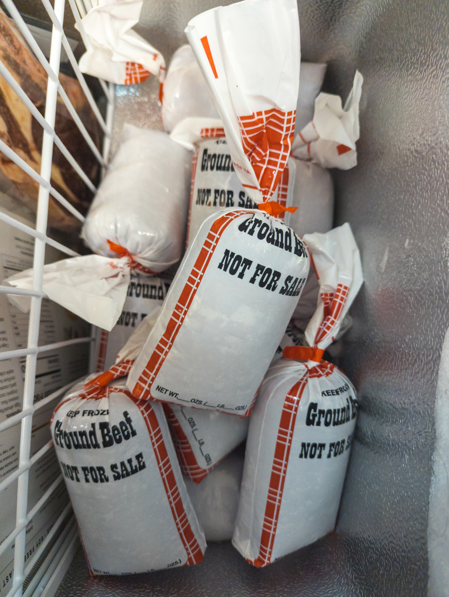 an overhead photo of ground beef in a deep freezer