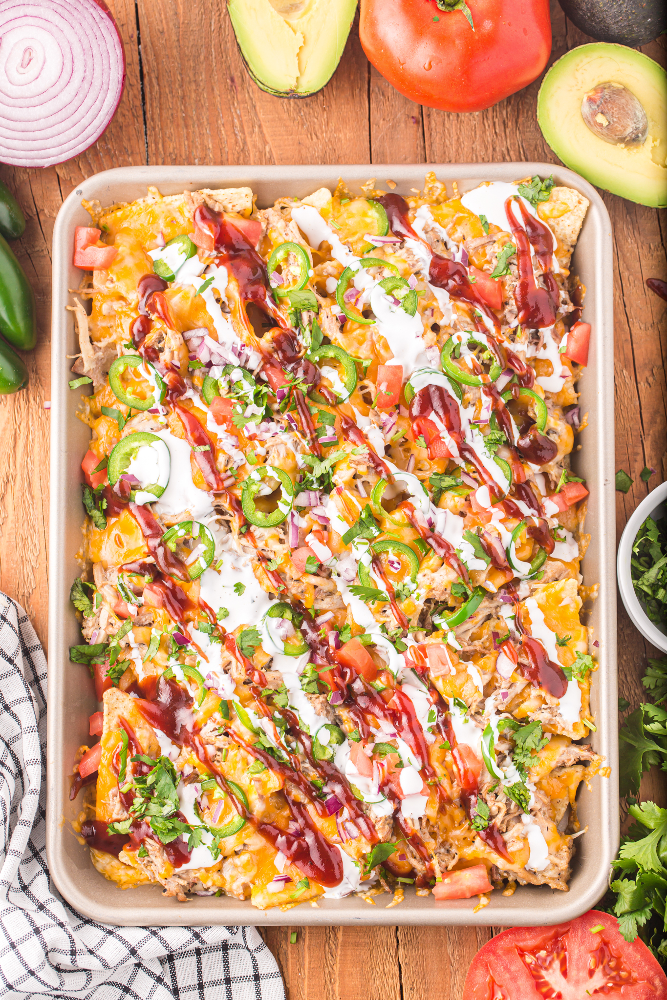 an overhead photo of sheet pan nachos with pulled pork