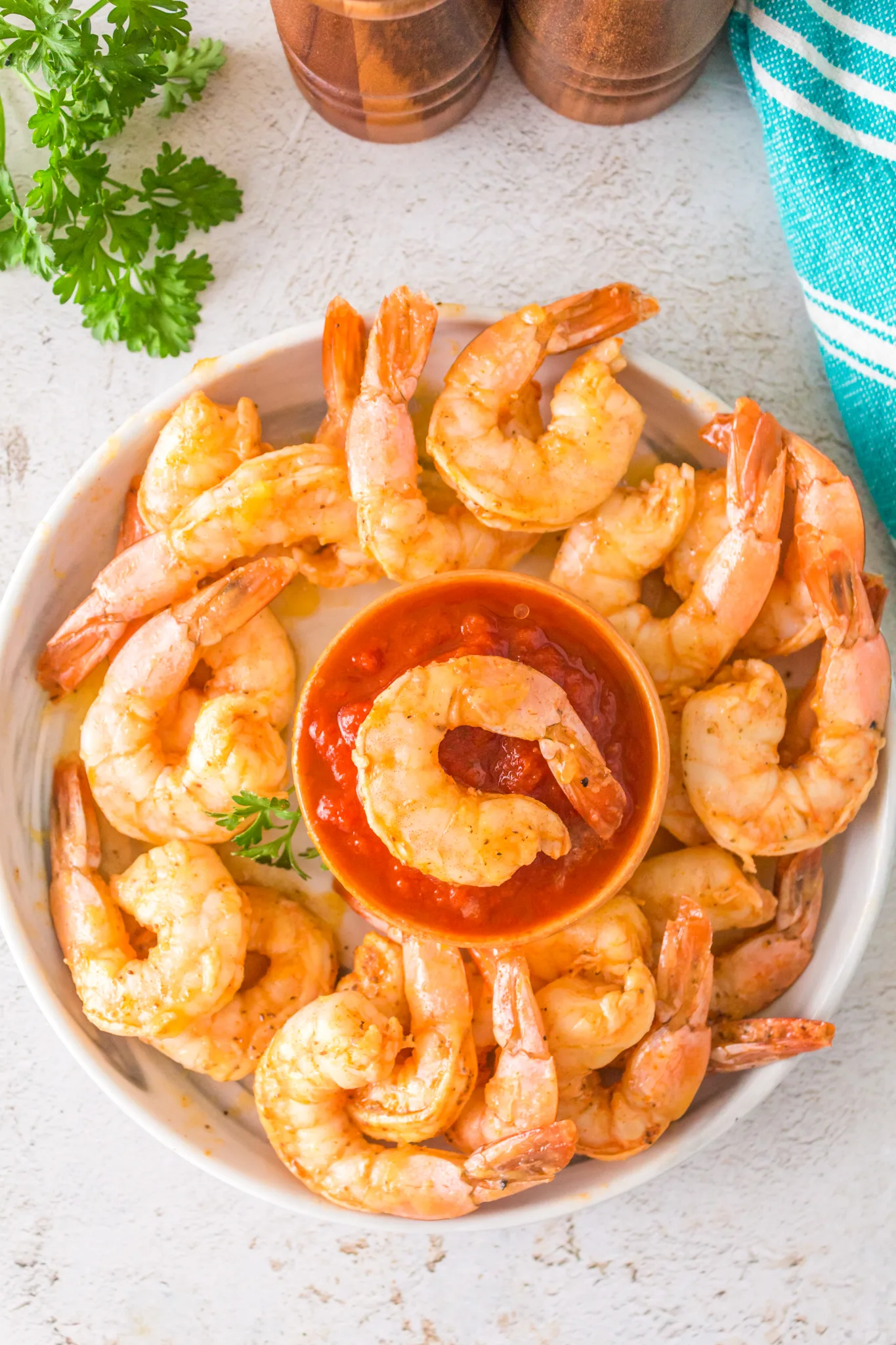 an overhead photo of smoked shrimp with a bowl of cocktail sauce