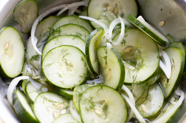 a close up photo of cucumber salad