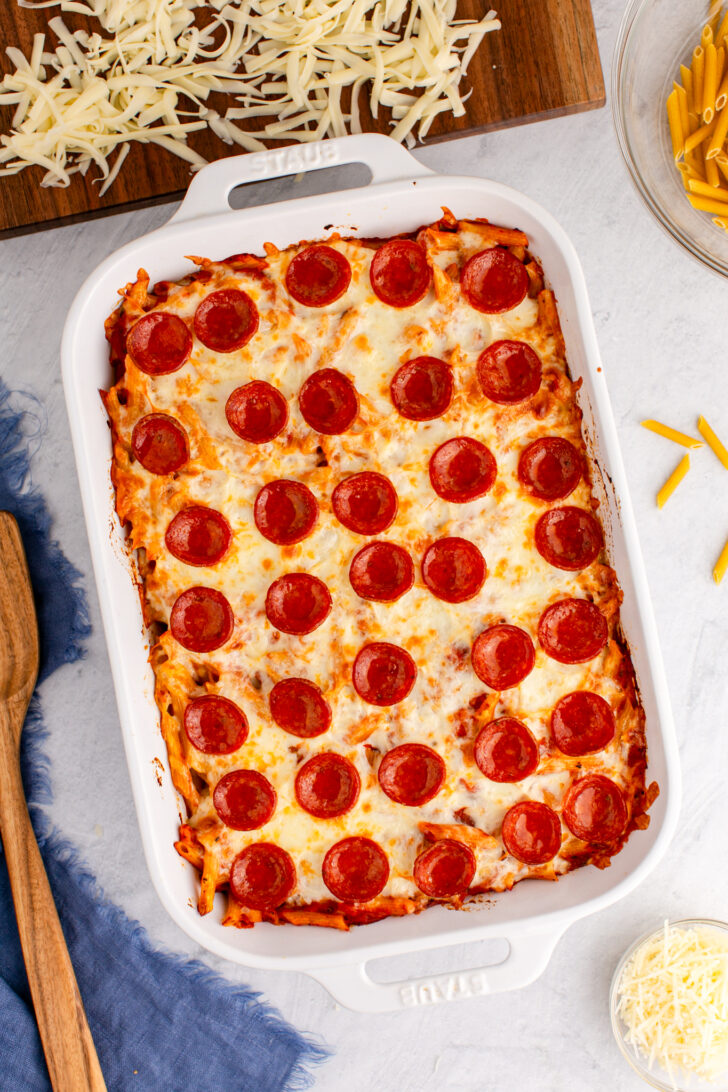 an overhead photo of pizza casserole in a white dish