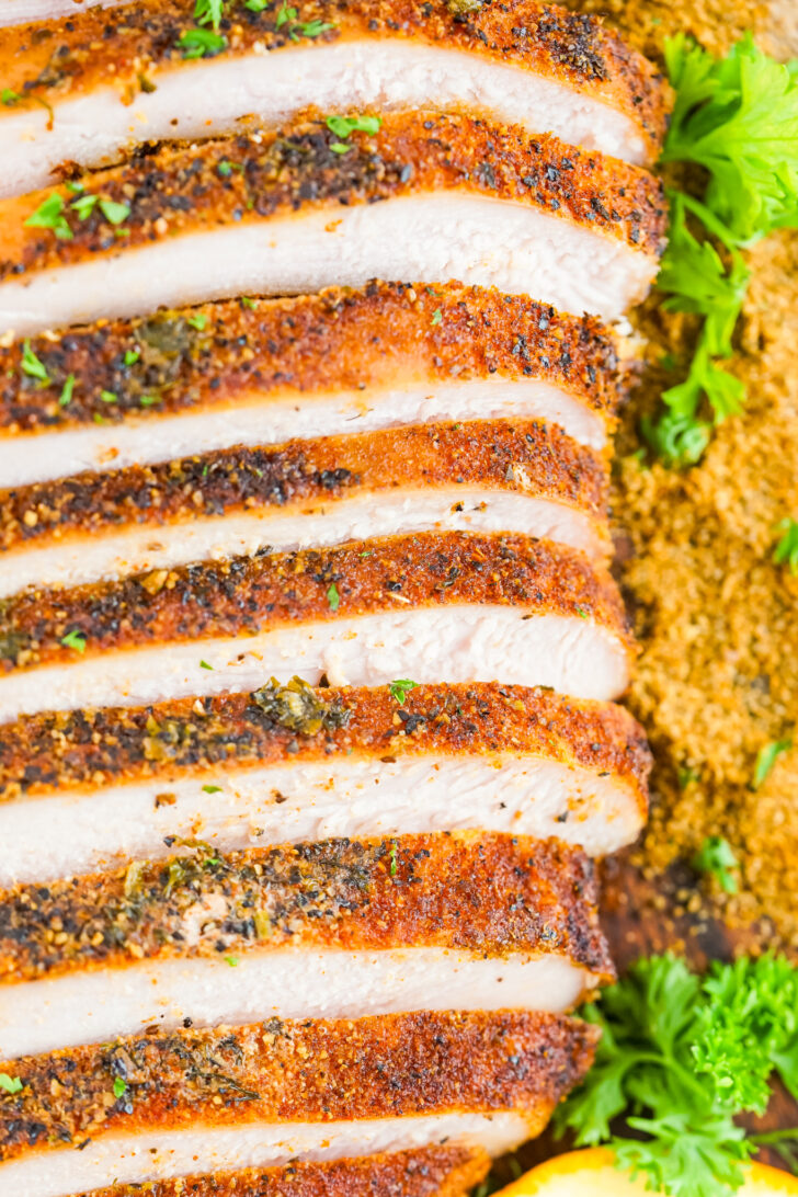 a close-up, overhead photo of sliced smoked turkey breast