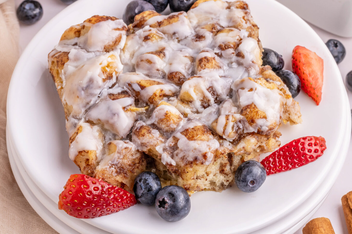 Cinnamon roll breakfast casserole with cream cheese glaze for decadent make-ahead weekend breakfast