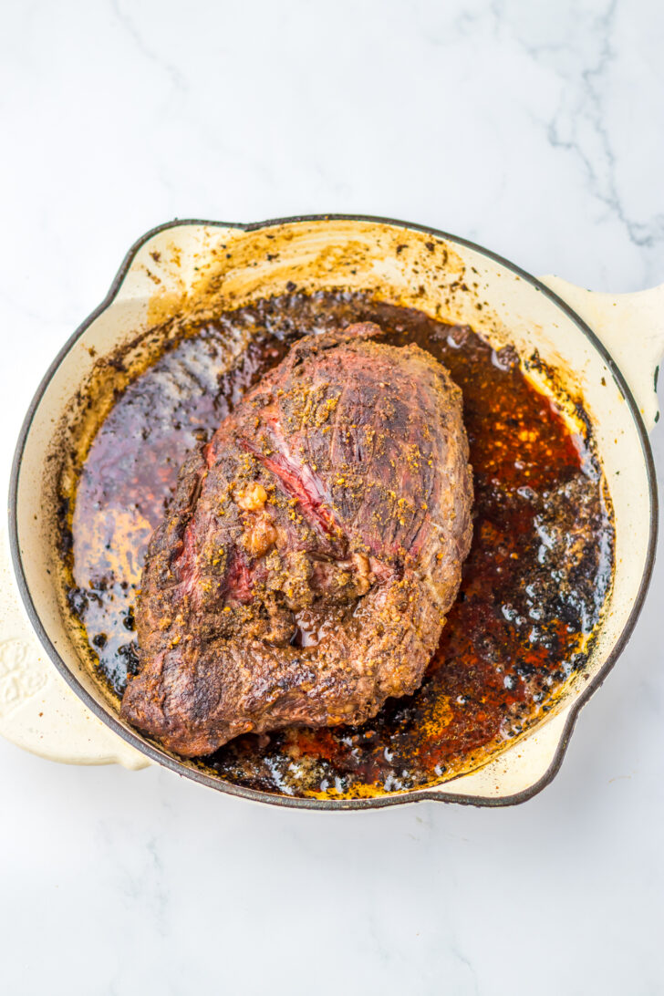 a photo of a roasted sirloin roast in a Dutch oven