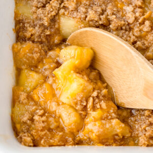 a photo of baked pineapple casserole in a white dish