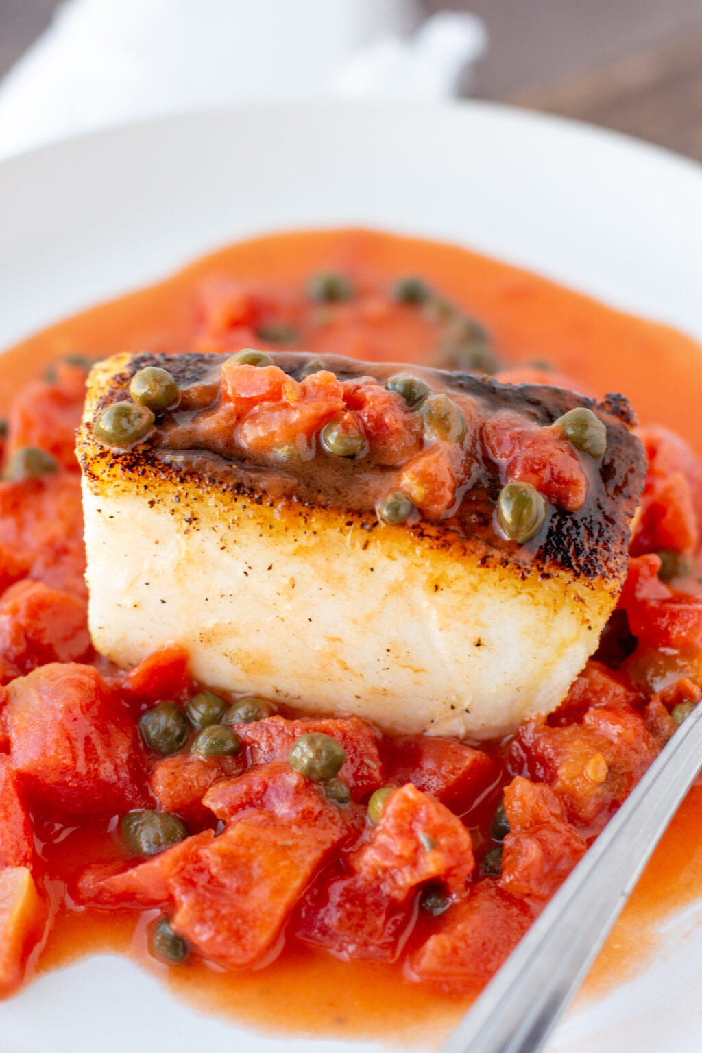 Pan Seared Chilean Sea Bass With Caper Tomato Butter