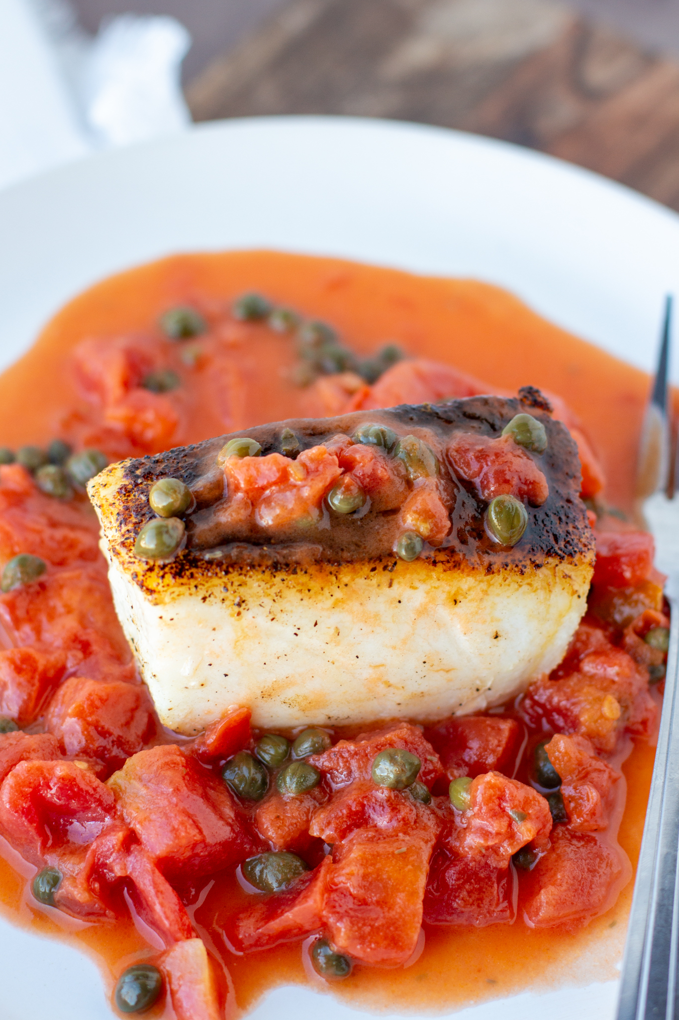 Pan Seared Chilean Sea Bass with Caper Tomato Butter