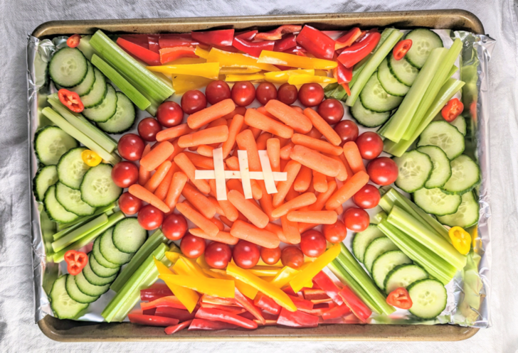 a photo of a football veggie tray