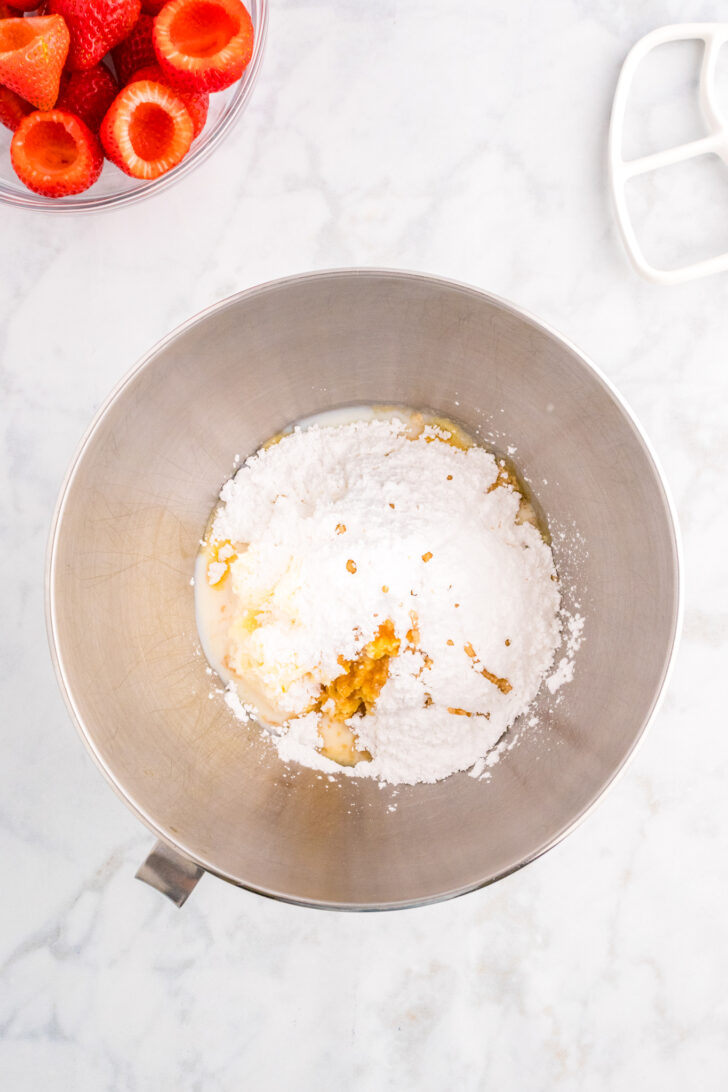 a  photo of cheesecake filling in a mixing bowl before its mixed together