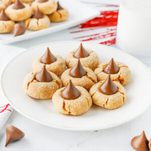 peanut butter blossom cookies on a white plate