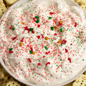 a white bowl filled with Christmas Sugar Cookie Dip