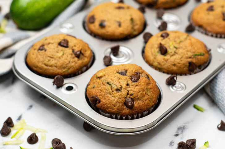 a muffin tin filled with chocolate chip muffins