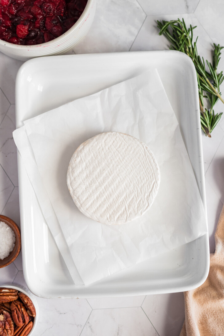 a brie round on parchment paper