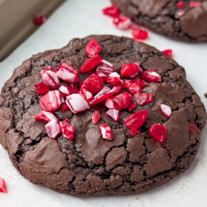 a photo of a chocolate cookie with crushed peppermint on top