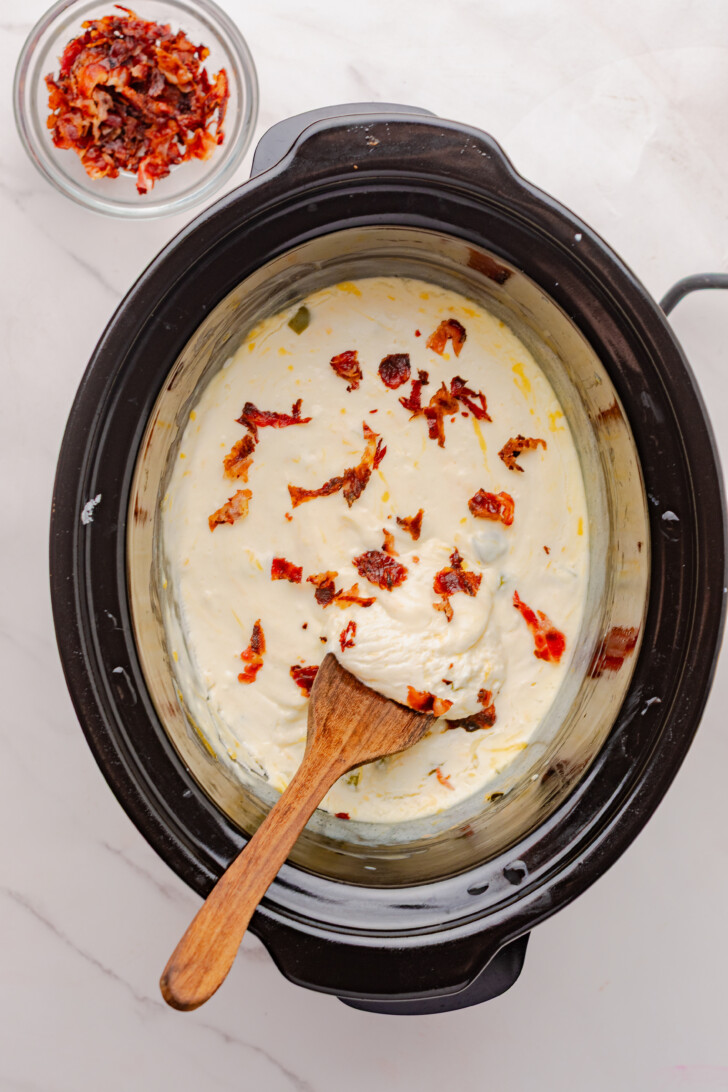 mixing bacon bits into a creamy dip