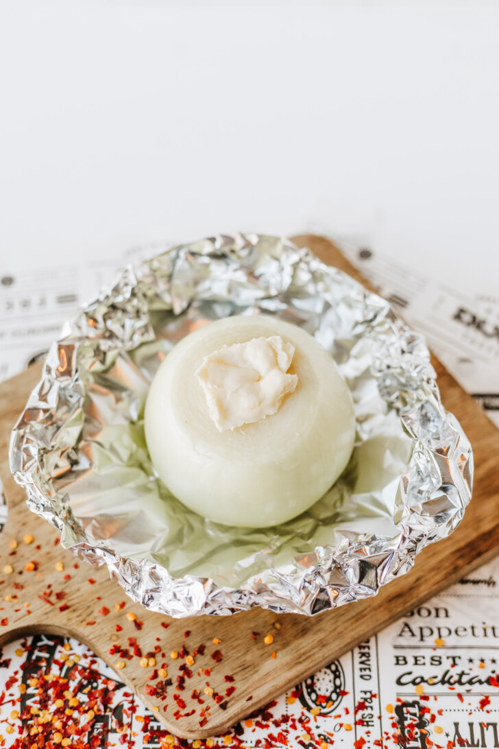 an onion stuffed with butter