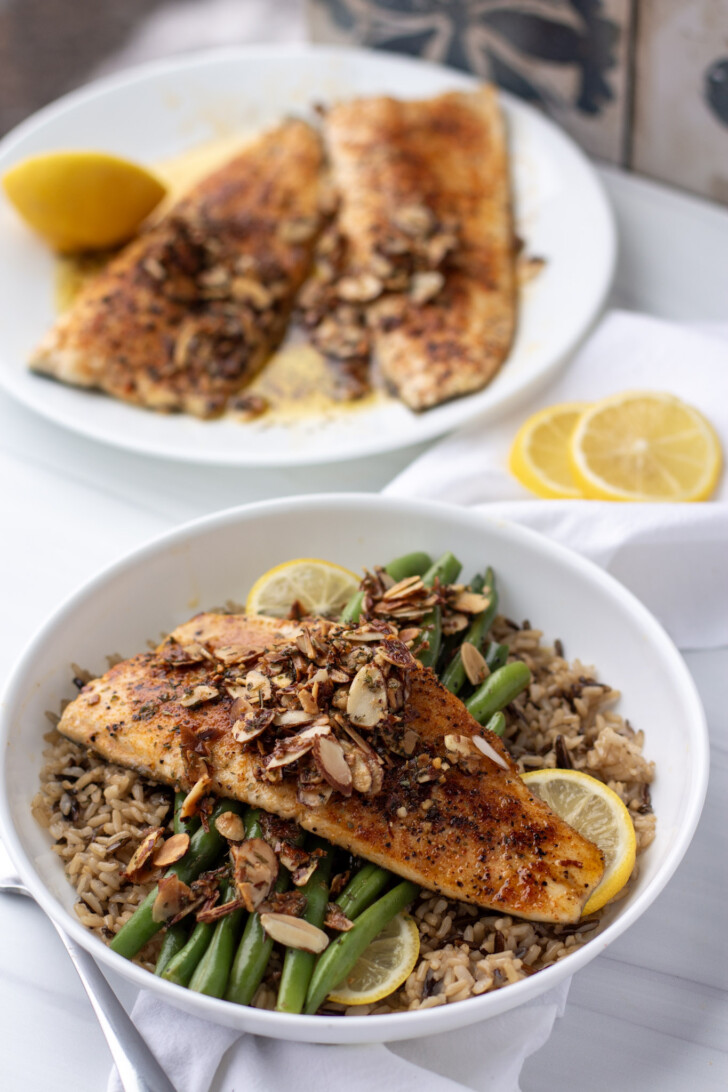 Easy Rainbow Trout Recipe in a White Bowl with Rice and Green Beans