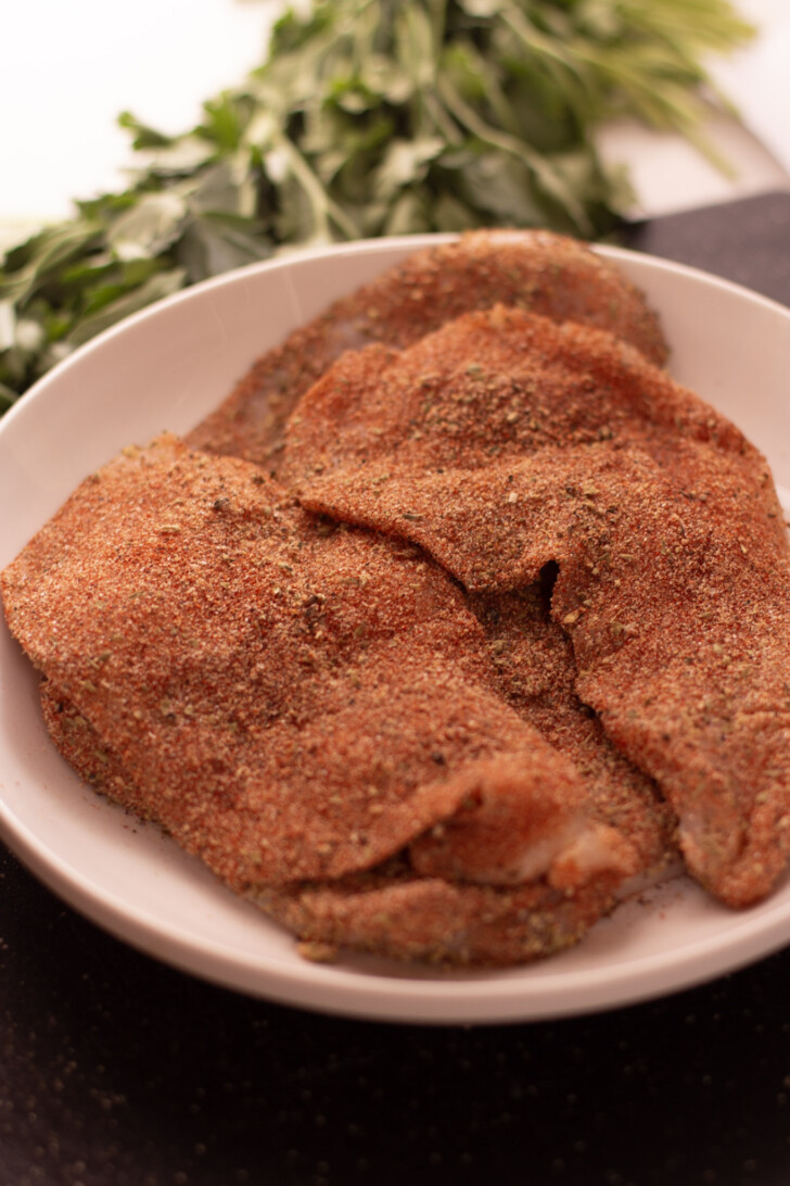thin cut chicken breast coated in blackened seasoning