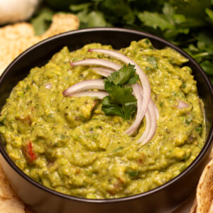 roasted poblano guacamole in a black bowl