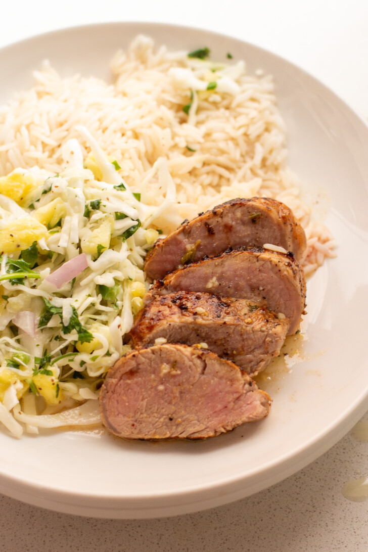 sliced pork tenderloin on a plate