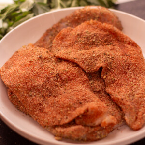 raw chicken breasts coated in blackened seasoning