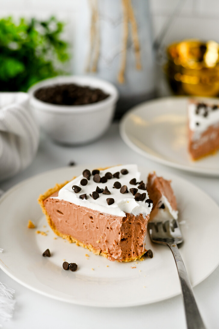a slice of chocolate pie with a bite taken out of it