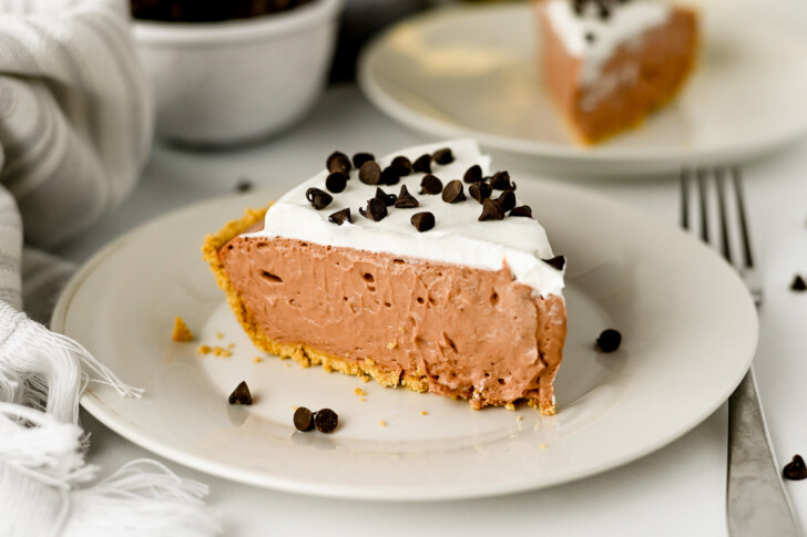 a slice of chocolate cream pie on a plate