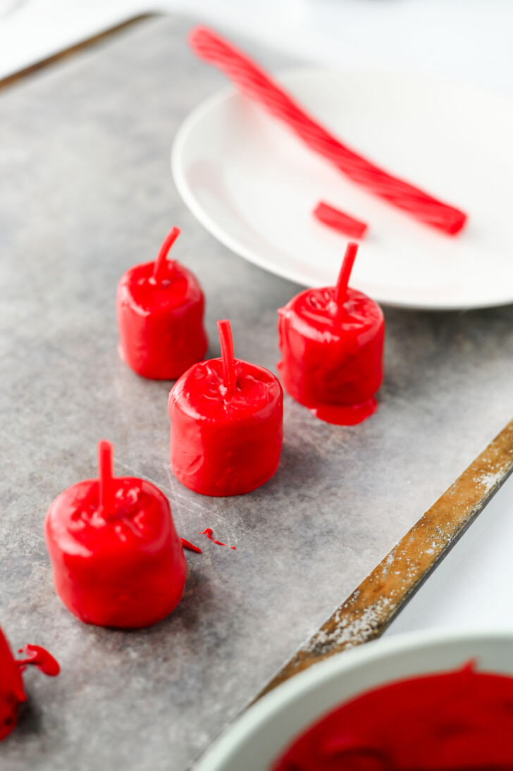 marshmallows coated in red candy melts