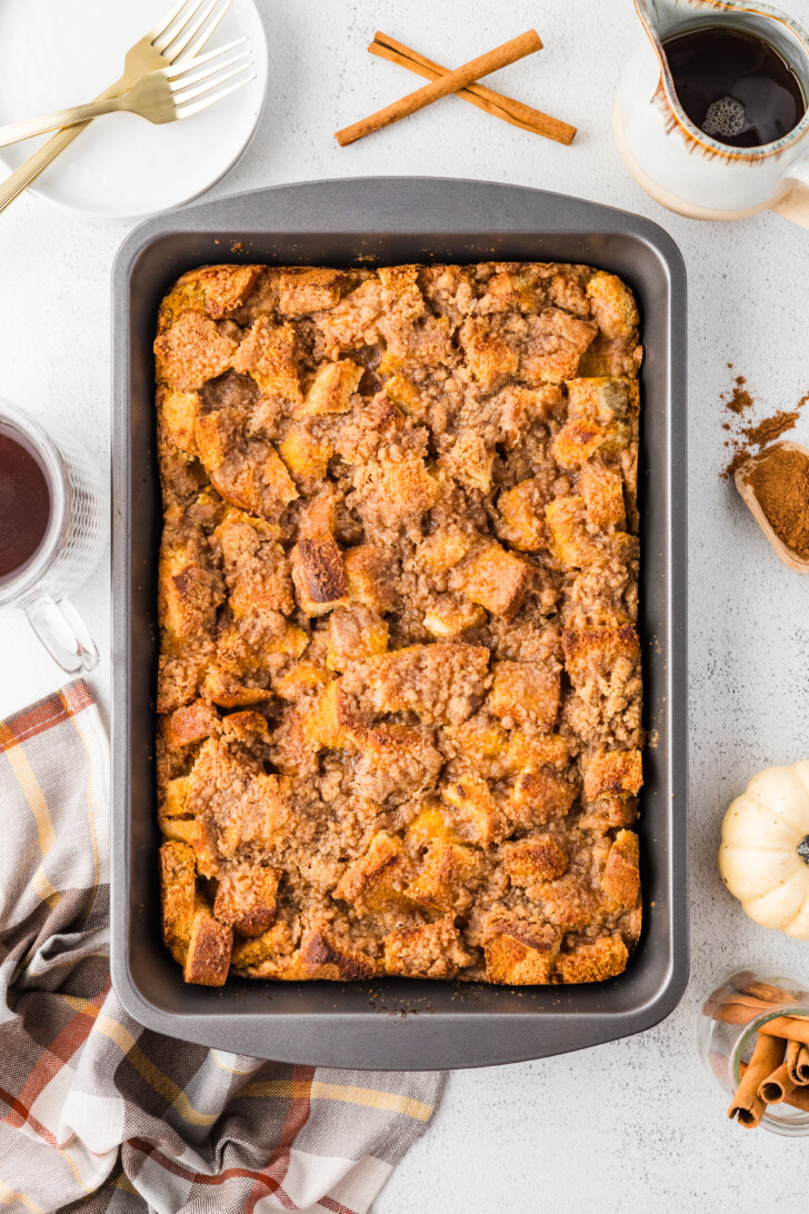 a baked pumpkin french toast casserole in a casserole dish