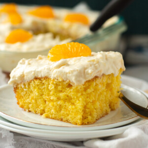 a slice of pineapple sunshine cake on a white plate