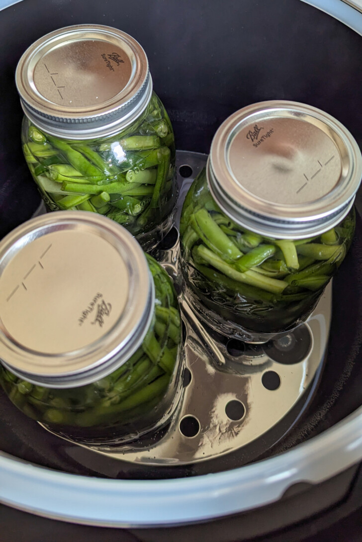 Jars of green beans in a pressure canner