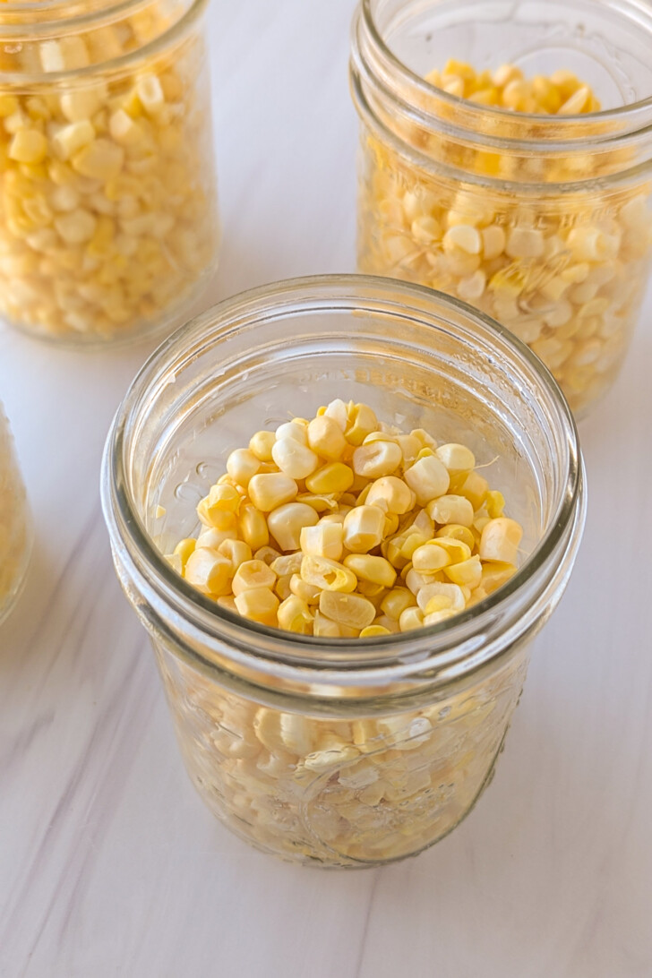 corn in a jar before the water is poured over top