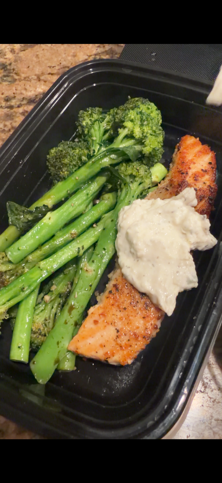 tsatziki salmon in a meal prep container