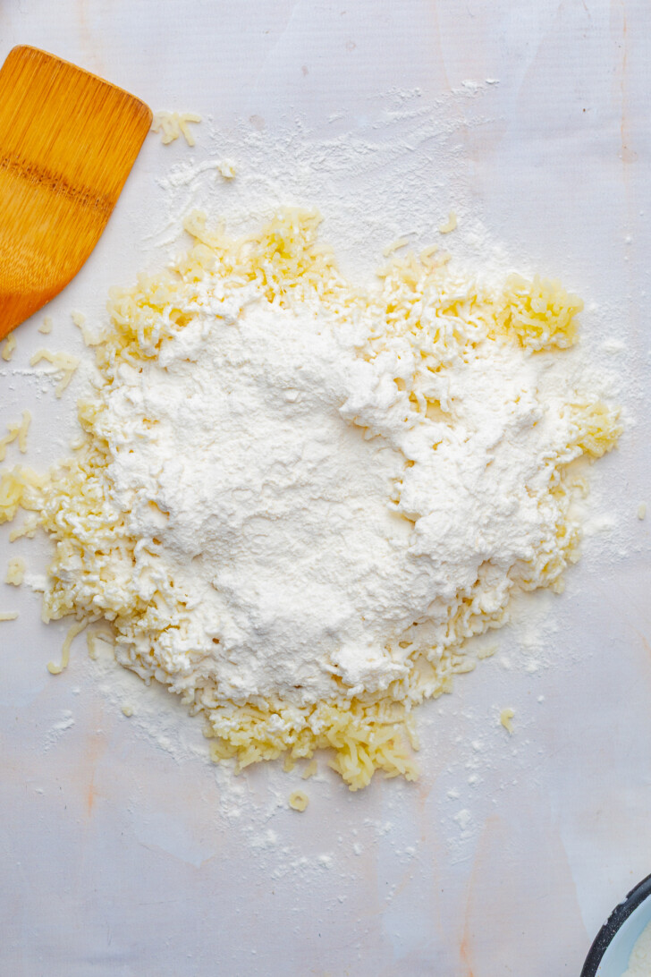 flour sprinkled over the top of cooked potatoes