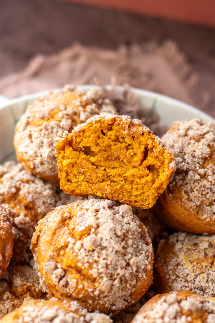 a halved pumpkin muffin made with pumpkin puree