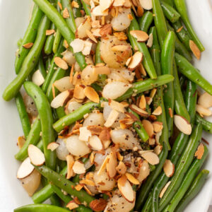 a platter filled with green bean almondine
