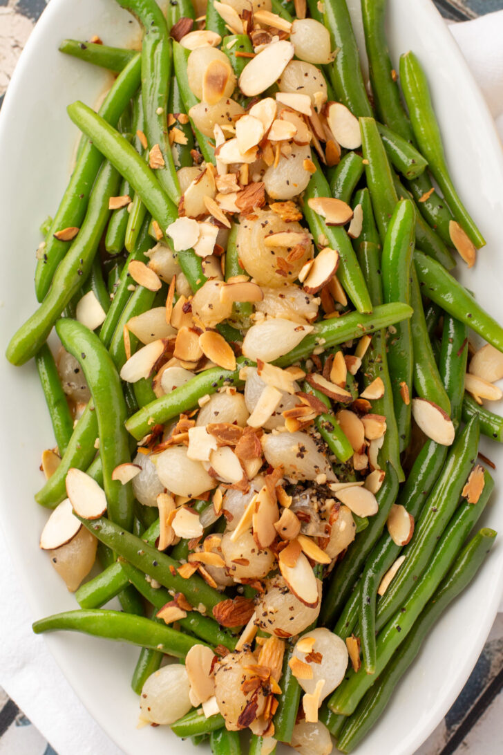 a platter filled with green bean almondine